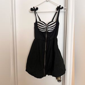 Black dress with black and white accent on the bust